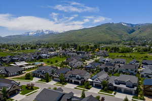 Aerial view of residential area featuring a mountain backdrop