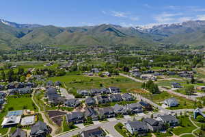 Aerial perspective of suburban area with a mountainous background