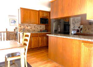 Kitchen with back splash and open spaces