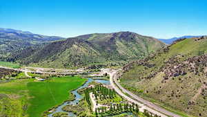 View of mountain backdrop with a nearby body of water