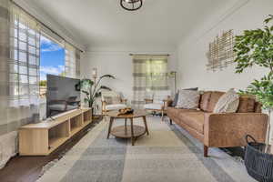 Living area featuring plenty of natural light and wood finished floors