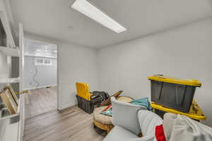 Living area featuring wood finished floors and baseboards