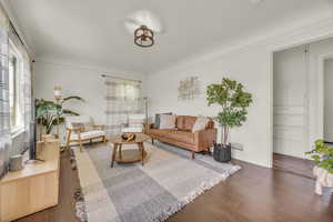 Living room featuring wood finished floors and baseboards