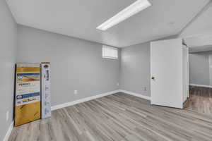 Below grade area with wood finished floors and baseboards