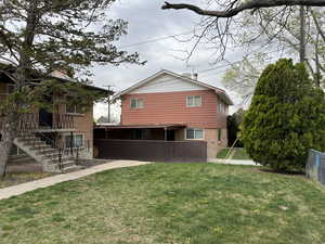 Back of property featuring brick siding