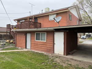 Rear view of property with a balcony