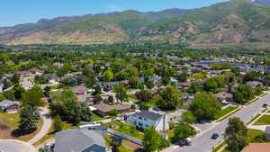 Aerial perspective of suburban area with a mountainous background