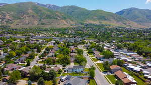 View of property location featuring a mountain backdrop and nearby suburban area