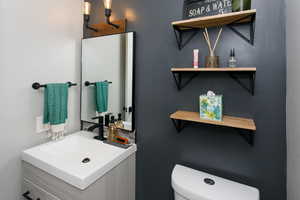 Bathroom with toilet and vanity