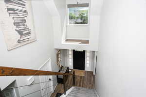 Entryway with a towering ceiling and baseboards
