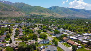 Aerial perspective of suburban area with a mountainous background