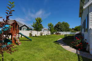 View of yard with a playground