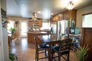 Dining space with tile patterned flooring and recessed lighting