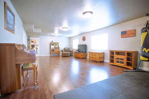 Misc room featuring wood finished floors and baseboards