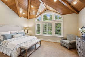 Vaulted tongue-and-groove ceiling with exposed beam detailing creates a warm, inviting atmosphere.