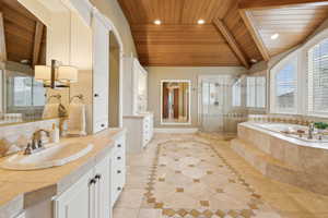 Luxurious spa-like bath in primary suite.