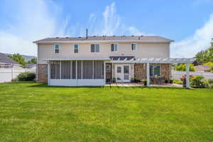 Backyard Featuring Screened in Porch, Pergola and Outdoor Entertaining