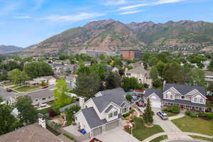 Aerial perspective of suburban area featuring a mountain backdrop