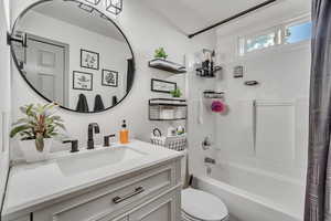 Full bath featuring toilet, shower / tub combo, and vanity