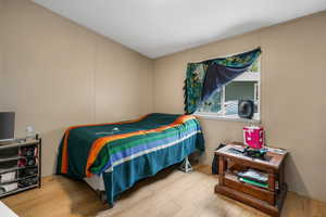 Bedroom featuring wood finished floors