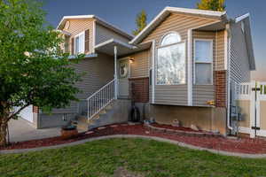 View of front of home featuring brick siding
