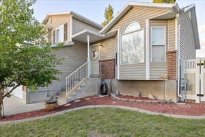 View of front of property with brick siding