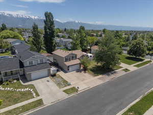 Aerial perspective of suburban area with a mountainous background
