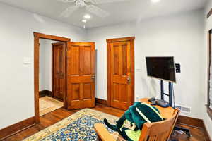 Office with baseboards, dark wood-style flooring, ceiling fan, and recessed lighting