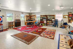 Office featuring recessed lighting, wood walls, and baseboards
