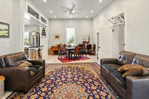 Living room featuring ceiling fan and recessed lighting