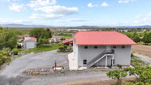View of shed featuring a mountain view and stairs