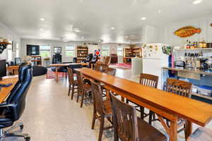 Dining room featuring ceiling fan and recessed lighting