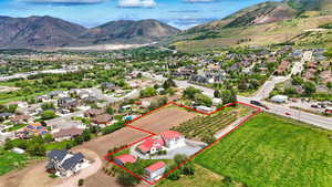 Aerial view of property's location with mountains and property boundaries highlighted