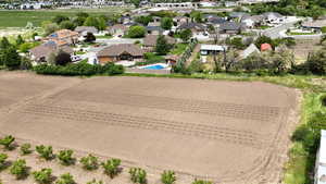 Aerial perspective of suburban area featuring a pool area