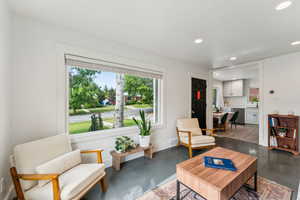 Living room with recessed lighting, baseboards, and painted hardwood floors