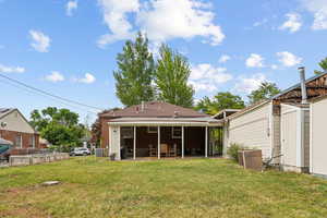 Large yard with patio, outbuilding, and spacious shed