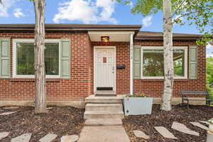Property entrance with brick siding