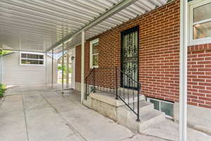 View of back door and carport