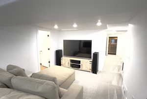 Living area featuring light carpet