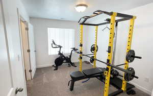 Exercise area featuring baseboards