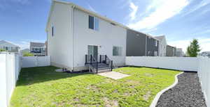 Back of house with a residential view and stucco siding
