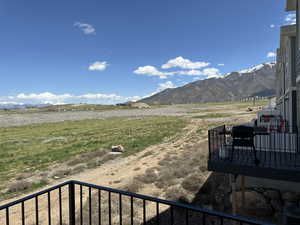 View of mountain backdrop with rural landscape