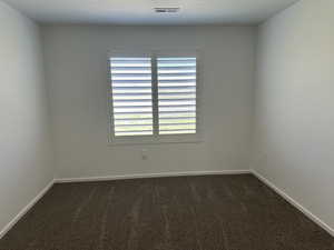 Unfurnished room with carpet floors and baseboards
