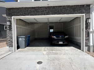 Garage with concrete driveway