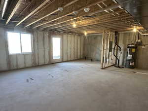 Below grade area featuring secured water heater