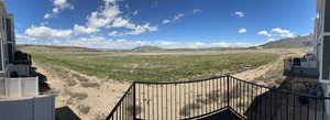 View of yard with a mountain view and a view of rural / pastoral area