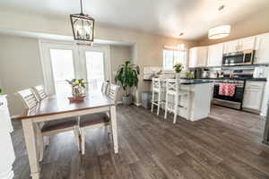Open kitchen and dining area with modern finishes and light.