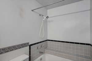 Full bath with toilet and  shower combination