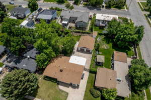 Aerial view of property and surrounding area featuring nearby suburban area