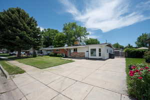 Ranch-style house featuring concrete driveway